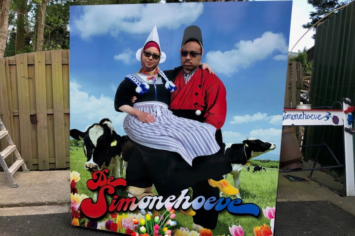 a man and a woman sitting on a bench