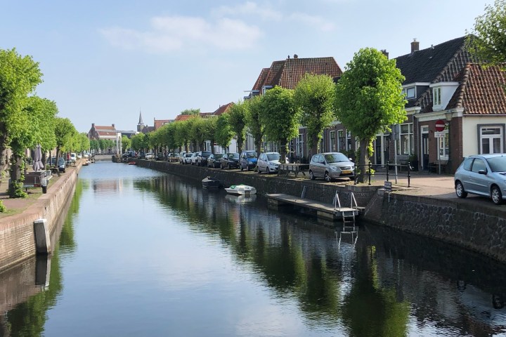 a small house in a body of water