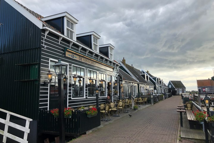 a train is parked on the side of a building