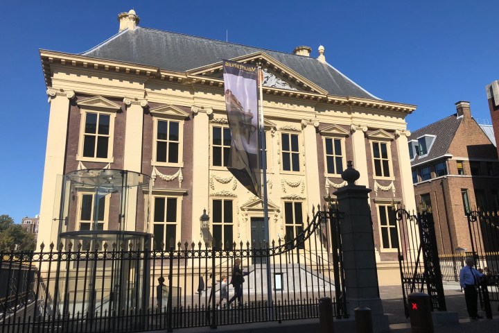 a large building with Mauritshuis in the background