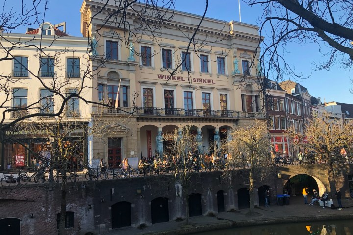 a group of people in front of a large building