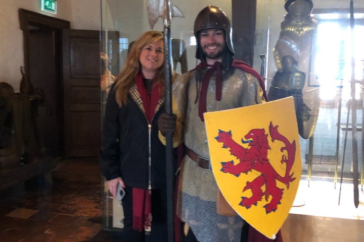 a person holding a sign posing for the camera