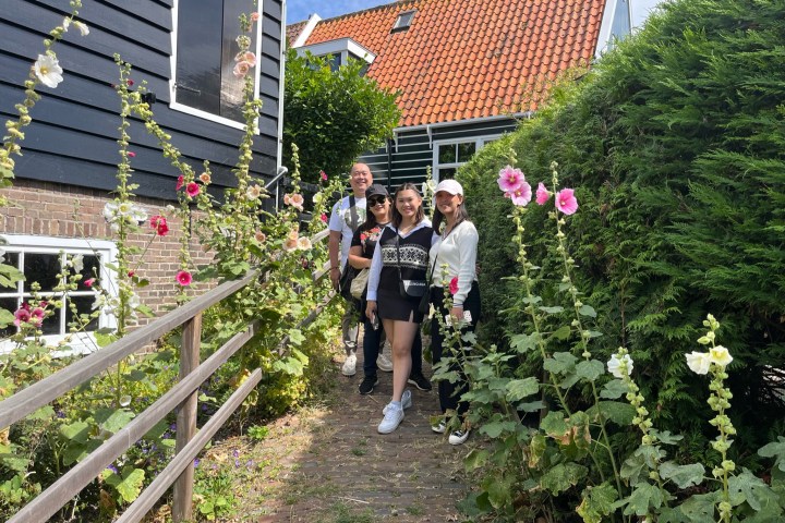 a group of people standing in a garden