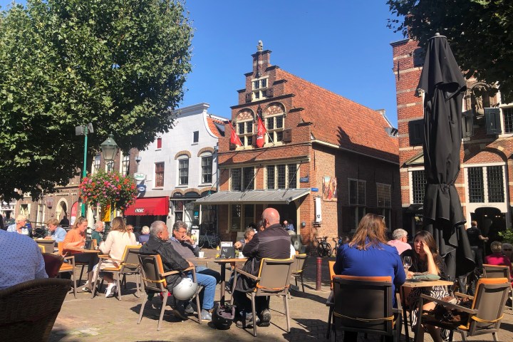 a group of people standing in front of a building