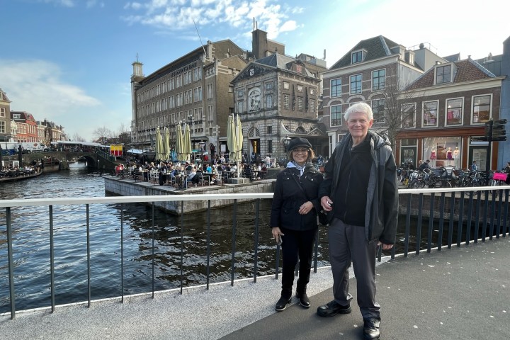 a group of people standing in front of a building