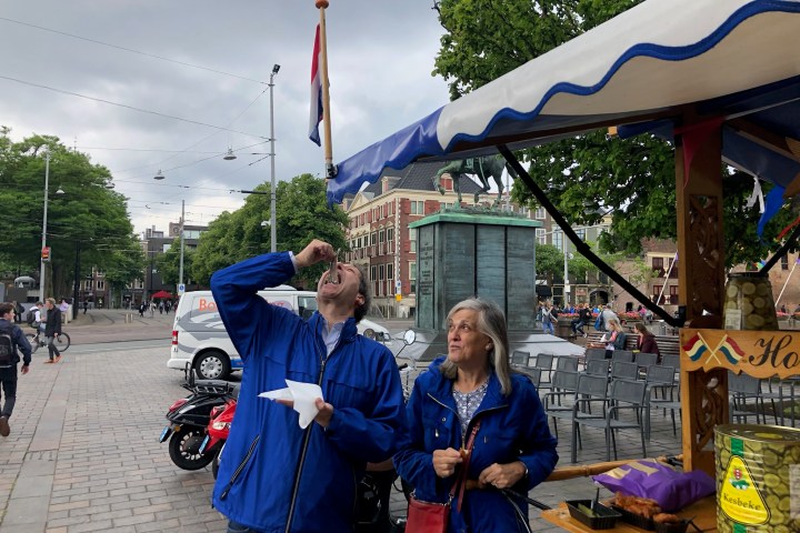 a group of people walking down a street