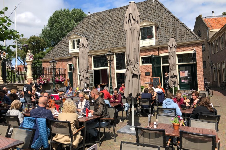 a group of people standing in front of a building