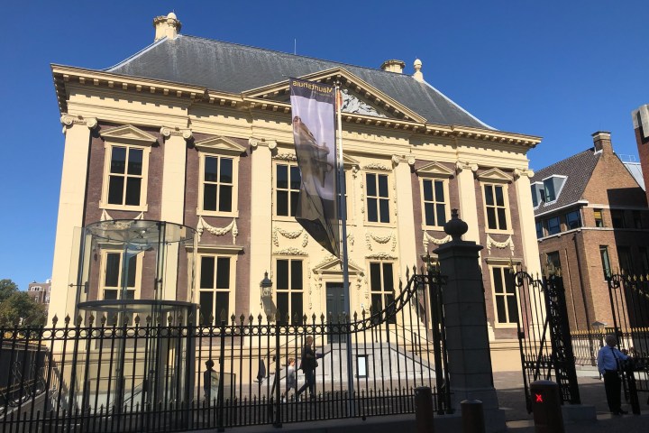 a large building with Mauritshuis in the background