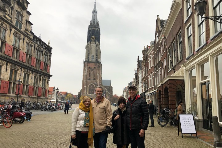 a group of people standing in front of a building