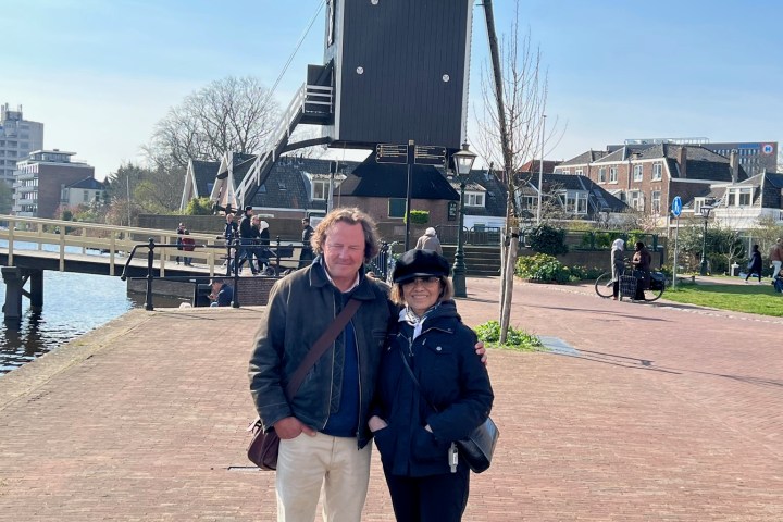 a man standing on a dirt road