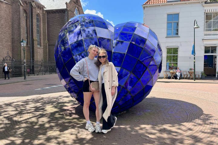 a man standing in front of a building