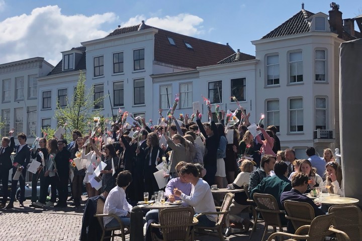 a group of people standing in front of a crowd