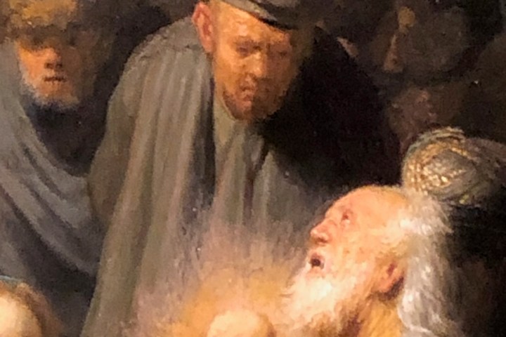 a group of teddy bears sitting next to a man