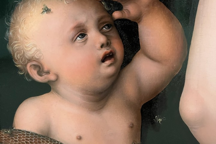 Renaissance painting of a cherubic child with bees and honeycomb.