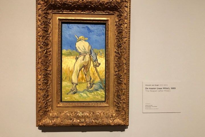 Painting of a reaper in a golden ornate frame displayed in a gallery.